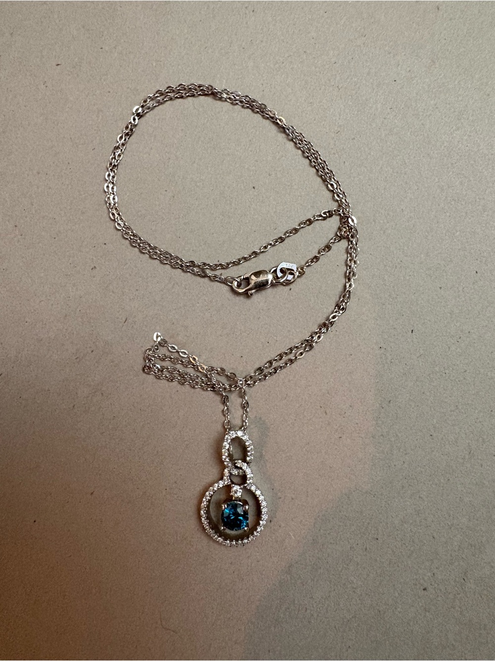 14k White Gold necklace with Blue Diamond with Infinity Halo from St Maarten